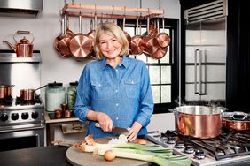 Martha cutting food in kitchen scene