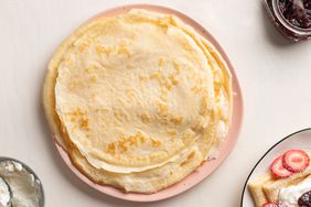 simple crepes stacked on a plate