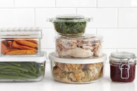 leftover thanksgiving food in glass containers in white kitchen