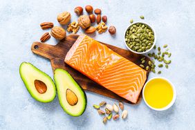 Healthy foods such as salmon, avocado, extra virgin olive oil, nuts and seeds like walnut, almonds, pecan, hazelnuts, pistachio and pumpkin seeds.