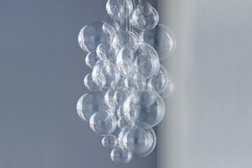 clear bubble chandelier on a blue grey background