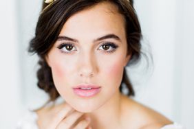bride wearing diamond-and-gold flowers crown