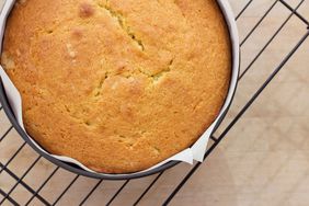 round yellow cake in parchment paper lined cake pan