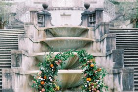 ceremony arch in front of fountain