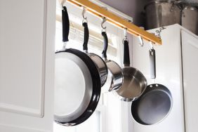 Pots and pans hanging from rack