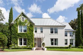 exterior shot of white houston home with ivy