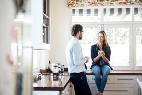 Couple at Home in the Kitchen drinking coffee