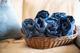 Dark jeans in basket for laundry