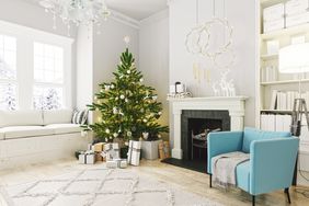 festive living room with a christmas tree and gifts