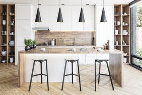 Modern white and hardwood kitchen with rectangular breakfast kitchen island