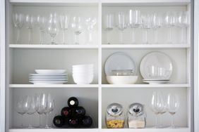 Wine glasses on kitchen shelves