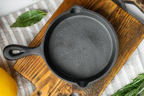 Empty frying cast iron pan background