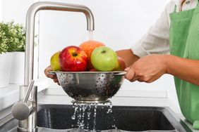 Washing fruit in the sink