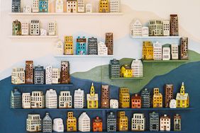 Wall of ceramic houses for guests to take home