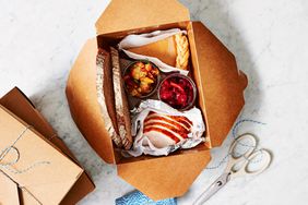 Thanksgiving leftovers in take-away box wrapped with string