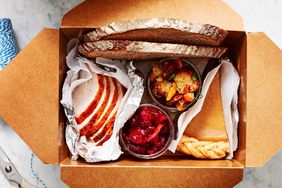 box of Thanksgiving leftovers for guest to take home