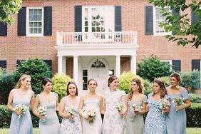 bride with bridesmaids in mismatched blue dresses