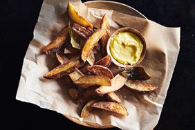 basket of olive-oil-fried potatoes with aioli