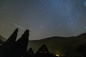 orionid meteor shower over mountains in japan
