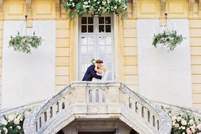 rachael cameron wedding couple kiss on staircase