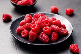 raspberries in a stone bowl