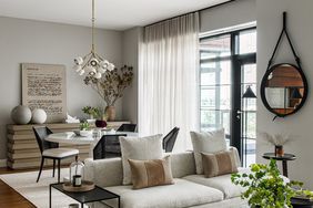 neutral-colored living and dining room with greenery