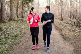 two women walking exercising together