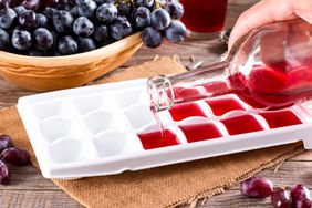 Pouring wine into ice cube tray