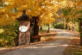 entrance to manor house with fall foliage